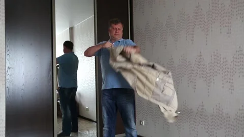The psycho man tears his clothes with anger. Nervous Breakdown Concept Video stock 162024048