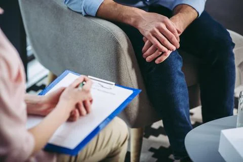 Psychologist making notes Stock Photos