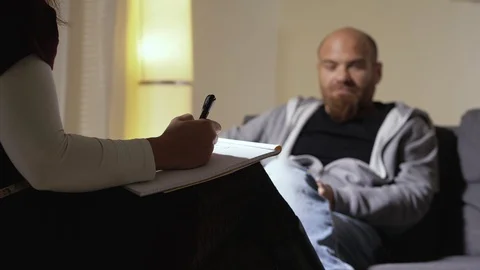 Psychologist session. young stressed man talking with his psychologist Stock Footage 107025255