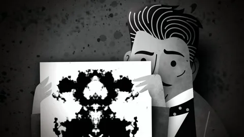 Psychologist showing a rorschach inkblot test 库存影片 342376765