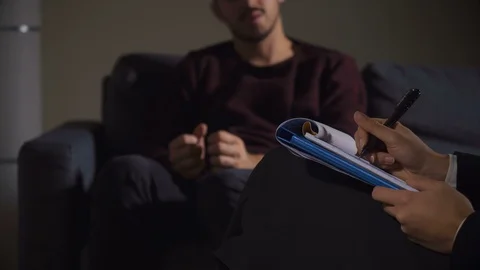 Psychologist Takes Notes During Therapy Session-close up Stock Footage 99965134