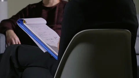 Psychologist Taking Notes During Therapy Session- close up Stockbeeldmateriaal 104970600