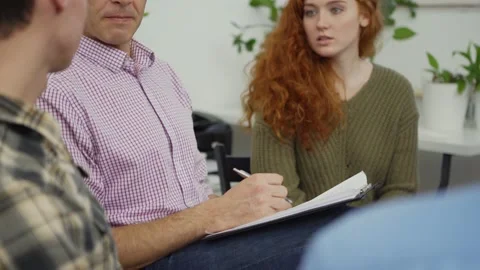 Psychologist talking to patinets at group session Stock Footage 142292759