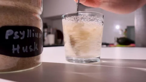 Psyllium gel formation in water on a kitchen counter for fiber diversity and Stock Footage 346309493