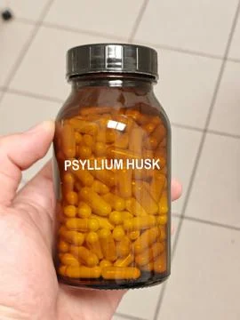 PSYLLIUM HUSK hard capsule bulk forming fiber supplement for constipation and Stock Photos