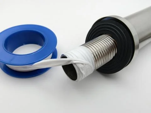 PTFE tape is applied to pipe threads Fotos de archivo