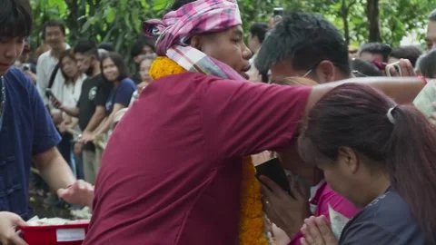 Pu Sae possessed medium blessing prostrating devotee at Pu Sae Ya Sae Liang Dong Stock Footage 336471020