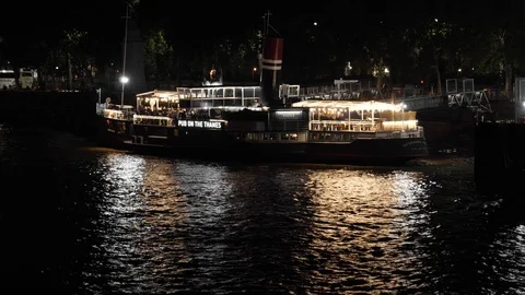 Pub boat on the river Thames at night Stock Footage 116302294