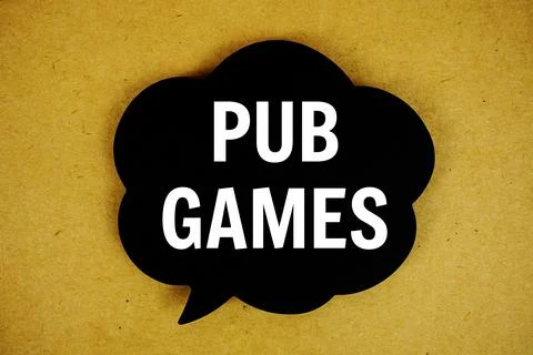 Pub Games text with speech bubble top view on yellow background Stock Photos