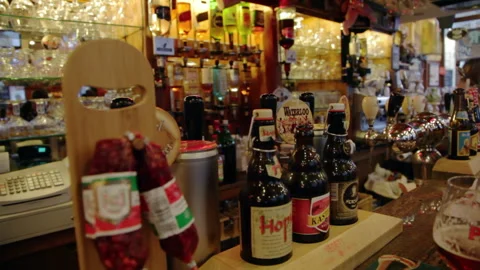 Pub Service Counter Display with Beer Bottles Salami and Taps Close Up 스톡 동영상 346765440