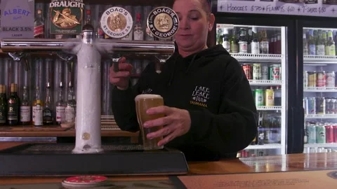 Pub Staff Pouring Draught Beer Into Pint Glass At Bar Stock Footage 340497877