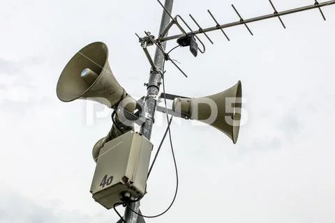 Public address system speakers on a pole, antenna and box with number 46 part Stock Photos