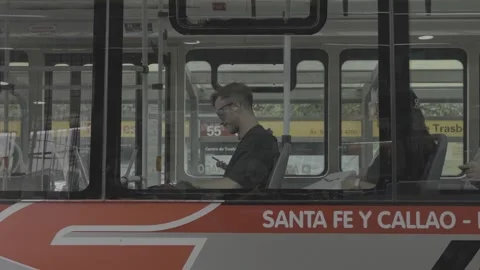A public bus and its passengers in Buenos Aires, Argentina Video stock 345139583
