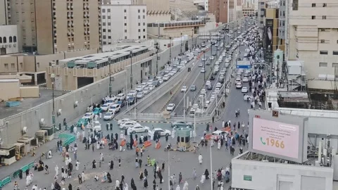 Public cab queue up looking for passengers outside Haram Mosque in Makkah, Stock Footage 274459547