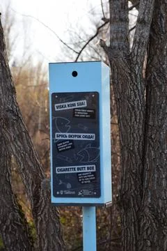Public cigarette butt collection box installed by the City of Tallinn stands Stock Photos