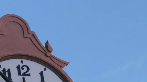 Public clock, clockwise are moving faster. TIME LAPSE-CLOSE UP-TILT DOWN. Stock Footage 42479671