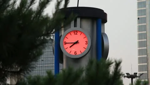 Public clock tower with pink background Stock Footage 11234640