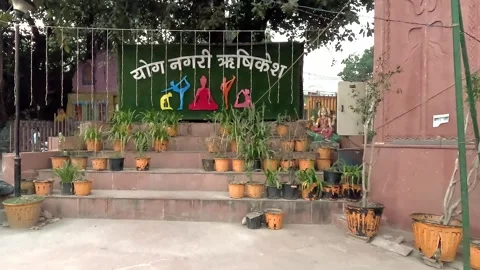 Public display board in Rishikesh translating to "Yoga City Rishikesh" with.. Stock Footage 337641938