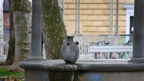 Public drinking water flowing from small fountain in Ljubljana city Stock Footage 170842779