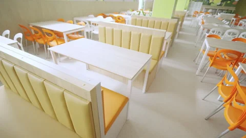 Public eatery exhibits uniform rows of fast food furniture Stock Footage 335217222