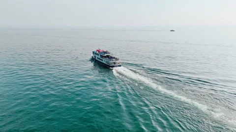 Public ferry on Lake Garda transporting passengers between lakeside towns Stock Footage 340067120