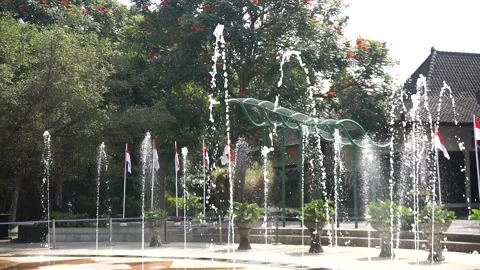 Public gathering area decorated with red and white flags and floor water 库存影片 342688936