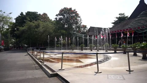 Public gathering area decorated with red and white flags and floor water 库存影片 342688985