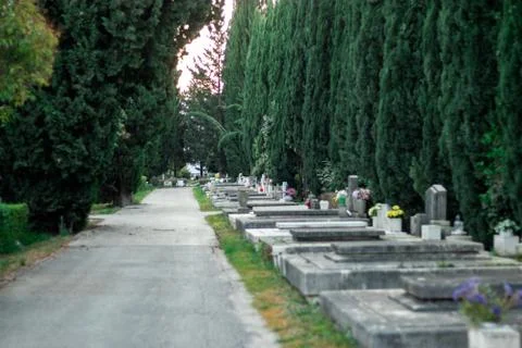 Public graveyard in split,croatia. Old stone grey gravestones lined up with b Stock Photos