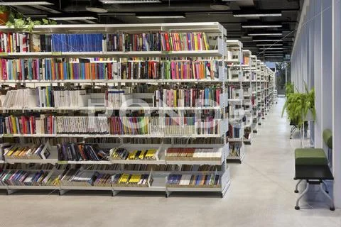 Public Library Interior With Books, Shelf And Aisle In Pärnu, Estonia. Books