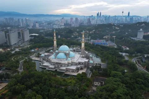 Public mosque in Kuala Lumpur during cloudy sunrise Stock Photos