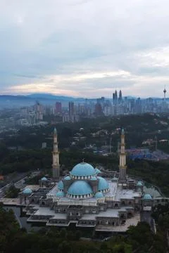Public mosque in Kuala Lumpur during cloudy sunrise Stock Photos
