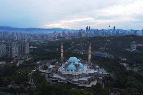 Public mosque in Kuala Lumpur during cloudy sunrise Stock Photos