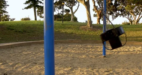 Public park playground with empty swing set Video stock 126304568
