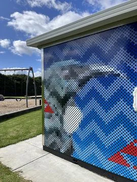 Public park playground structure featuring a pixelated graphic art panel on.. Stock Photos