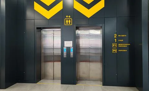 Public passenger elevator metal, silver color, against the background of black 写真素材