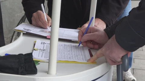 Public petition signing  Stock Footage 121013964