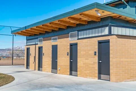 Public restrooms with security camera installed beneath the flat roof Stock Photos