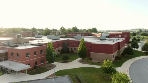 Public School and District Office brick building exterior, aerial drone Stock Footage