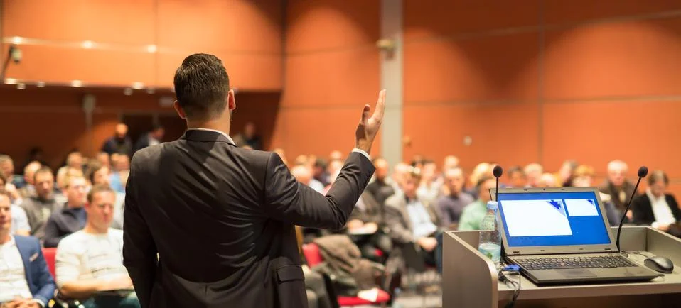 Public speaker giving talk at business event Stock Photos