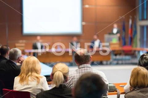 Public speaker giving talk at business event Stock Photos