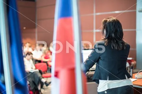 Public speaker giving talk at Business Event. Stock Photos