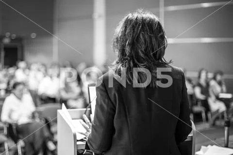 Public speaker giving talk at Business Event. Stock Photos