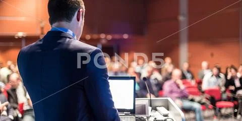 Public speaker giving talk at business event. Stock Photos