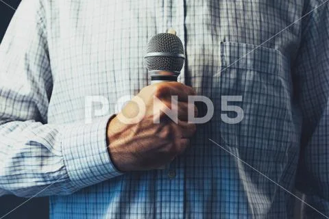 Public speaker holding microphone Stock Photos