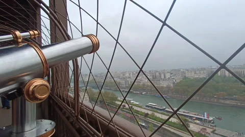 Public telescope overlooking The Seine River and Paris cityscape Video stock 342432392