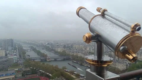 Public telescope overlooking The Seine River and Paris cityscape Stock Footage 342435717