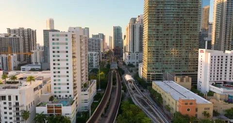Public train system in urban landscape of downtown Miami Brickell in Florida Stock Footage 333700405
