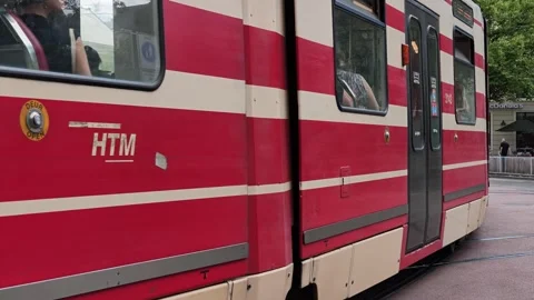 Public Tram Driving Through Downtown Street Stock Footage 342342750