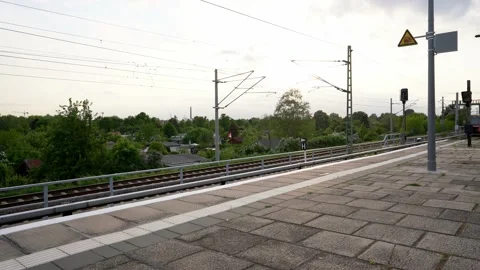 Public transit in Germany. S-Bahn Train in Berlin passing by station Stock Footage 195821222