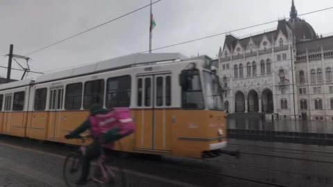 Public transit trams meet in front of Kossuth Lajos Square, Parliament Stock-Footage 297874673